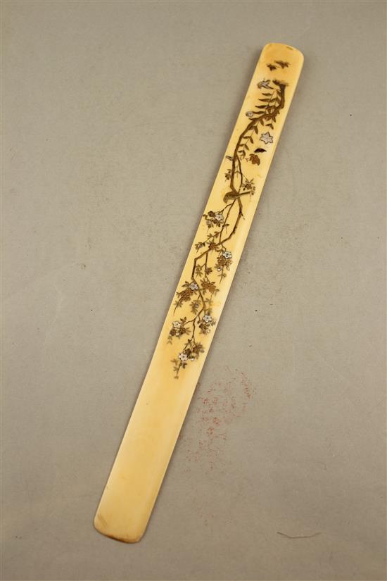 A Japanese ivory and shibayama type page turner, Meiji period, 38cm., restorations